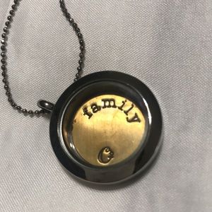 Origami Owl locket on 18” chain. Comes with 4 charms and “Family” plaque